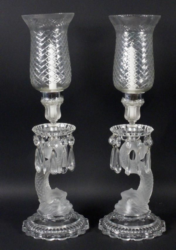 A PAIR OF BACCARAT CANDLESTICKS ''DAUPHIN'' Colourless crystal glass ...