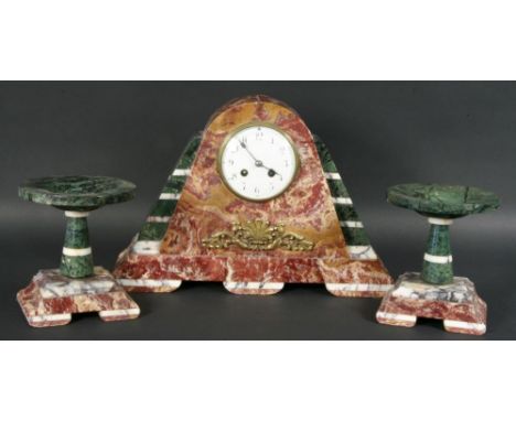 AN ART DECO MANTEL CLOCK GARNITURE France ca. 1925 Different coloured marble casing with two matching candelabras, pendulum, 