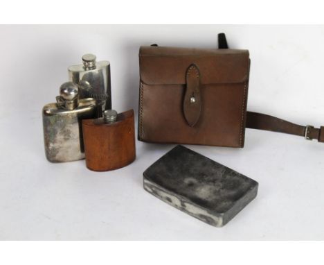 A leather saddle pouch containing a sandwich tin and a silver plated hip flask, leather covered hip flask and Jack Daniels hi