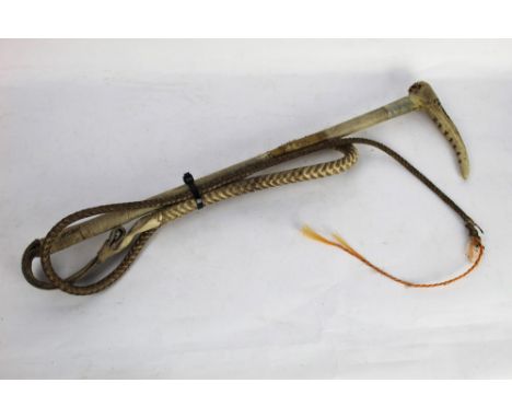 Swaine a hunting whip with red stag antler handle, metal collar stamped Swaine with wrapped shaft and thong section with whip