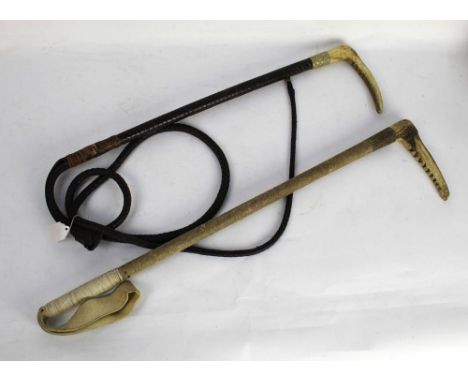 A Swaine hunting crop with red stag antler handle, metal collar, wrapped shaft and thong section, length excluding thong 58 c