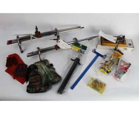 Archery equipment - two outdoor bow stands, a fletching kit, various bow strings, bow power scale calculator, racing height g