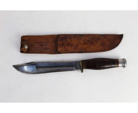 J.H. Thompson of Sheffield, a Bowie type knife with hollow ground blade and leather handle, with +/- 7 3/4" blade, 33 cm over