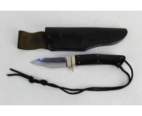 Alan Wood a fixed blade knife with 3 1/2" blade marked A Wood England, with red liners and Micarta scales, 21.5 cm overall wi