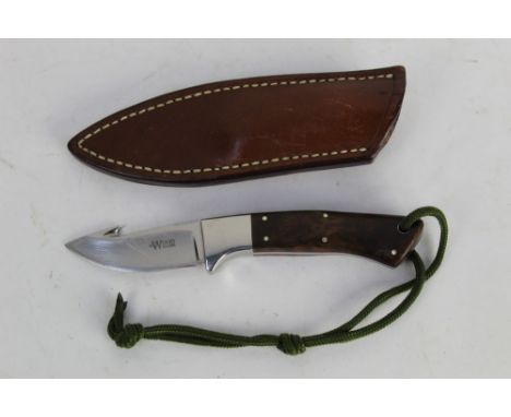 Alan Wood a fixed blade knife with gut hook, with 2 1/2" blade marked A Wood England, with red liners and wooden scales.  Ove