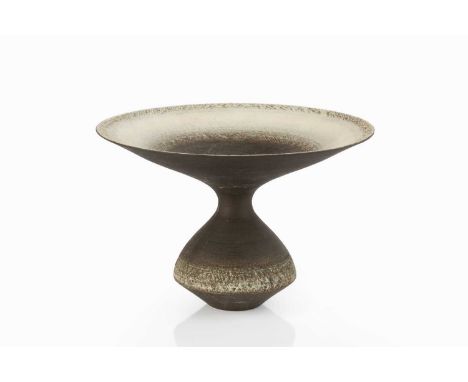 Graeme James (b.1942)Vase with flared rimtextured light and dark glazeimpressed potter's seal15cm high, 22.7cm diameter. Prov