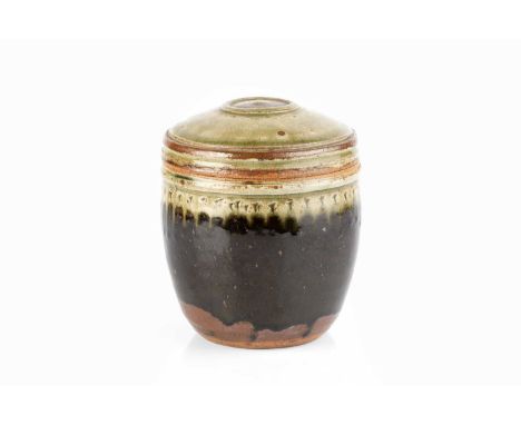 Richard Batterham (1936-2021)Caddy and covergreen ash glaze lid and rim, tenmoku body15.cm high.Appears in good condition wit