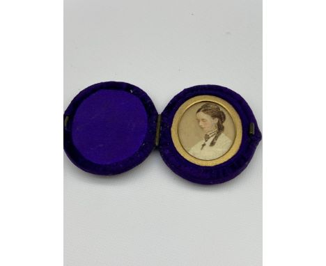A 19th century miniature hand painted lady portrait. Fitted within a blue velvet frame. 