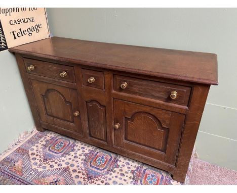 A 17th century style solid oak three over two sideboard/ console unit. A piece from Liberton Tower [76X134X47CM] Liberton Tow