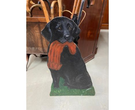 A Novelty hand painted black Labrador umbrella/ stick stand. Contains a selection of various walking sticks and umbrellas [81