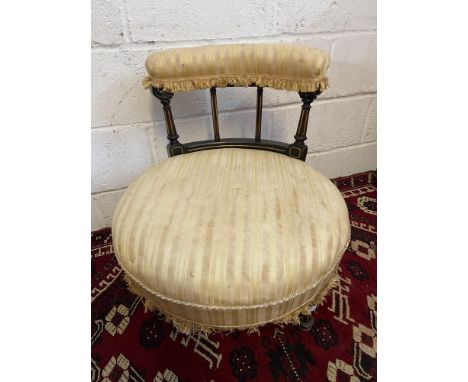 A 19th century nursing chair, Designed with turned leg supports with gilt trims and ceramic castors. [Standing 62cm high and 