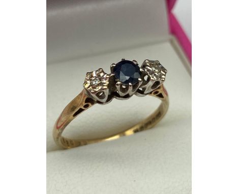 A 9ct gold Diamond and Sapphire ring. [Ring size P] [2.30GRAMS] 