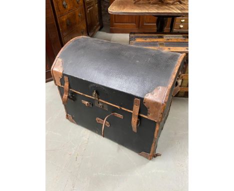 A 19th century canvas and leather bound dome top trunk. Wicker weaved frame. Fitted with interior drawer and leather handles 