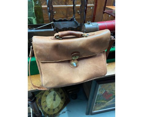 A Light tanned satchel bag with tartan interior designed by Hidesign. 