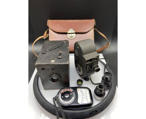 A Vintage Bell &amp; Howell Filmo Double Run Eight Model 134-a cine camera with various lenses, case and together with a Coro