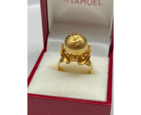 A Chinese gold ball ring [possibly 22ct gold] [Ring size N] [6.65Grams] 