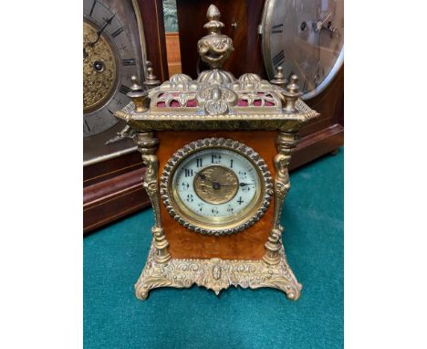 A Victorian brass bound and burr walnut mantle clock. Designed with a picture dial face. [26cm in height] 
