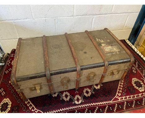 A Vintage wooden bound canvas trunk. Designed with an interior drawer. [L 91cm W 52cm]. 