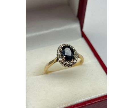 A Ladies 18ct gold Single Sapphire and diamond ring. [3.31Grams] [Ring size N] 