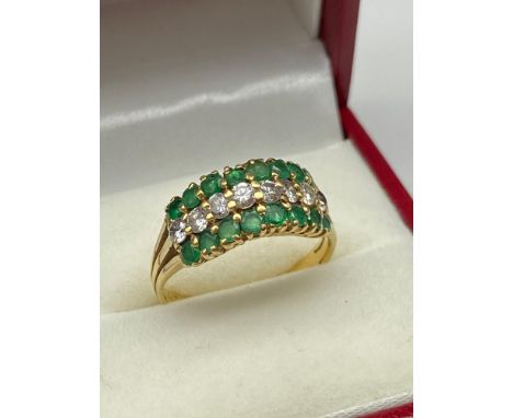 A Beautiful Ladies 18ct gold, Emerald &amp; Diamond cluster ring. [Ring size M 1/2] &amp; [2.82Grams] 