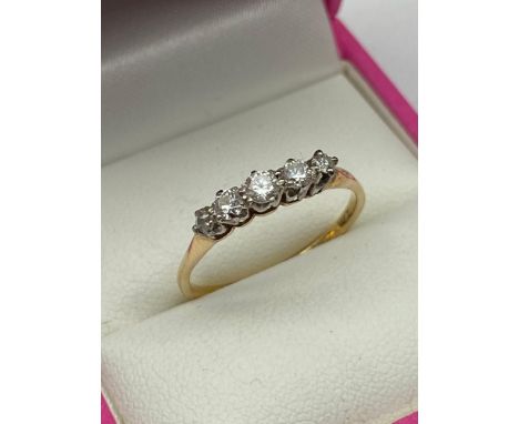 A Ladies gold [Rubbed mark] five stone ring. [2.10grams] [Ring size P] 