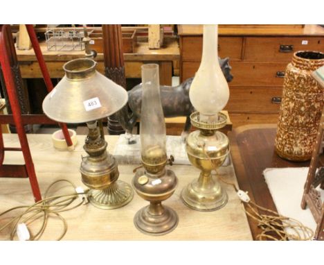 Three vintage oil lamps two converted to electric.