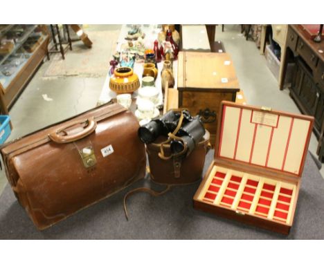 A vintage leather briefcase ,a pair of cased binoculars etc.