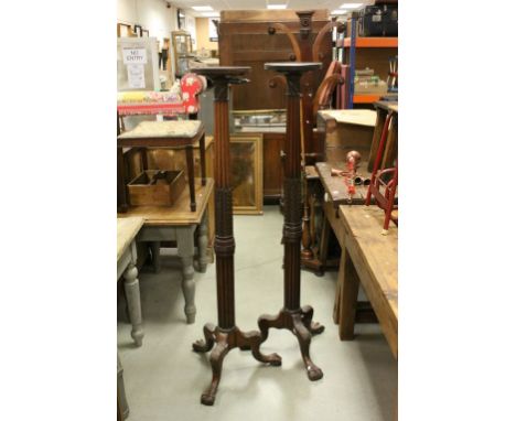 Pair of 19th century Tall Mahogany Torcheres, the Turned Ringed Tops on Carved Corinthian Column and Leaf Supports and Tripod