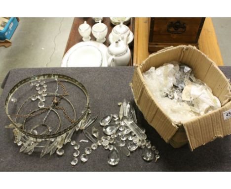 A four tier hanging light with glass droplets.
