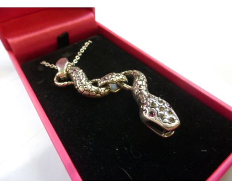 A silver snake necklace with ruby eyes 