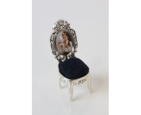 A sterling silver pincushion in the form of a Chippendale style chair  