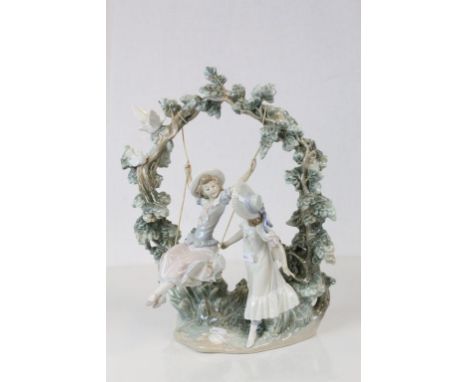 Large Lladro Model of a Girl on Swing with another Girl pushing her, both under an Arch of Branches with Birds, stamped to ba