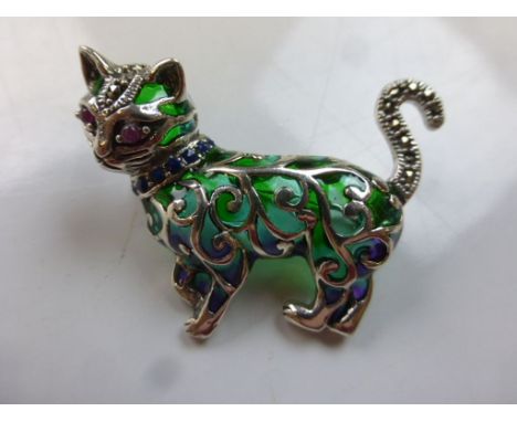 A silver and plique a jour cat brooch with ruby eyes 
