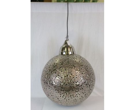 A contemporary metal Moroccan style hanging light.
