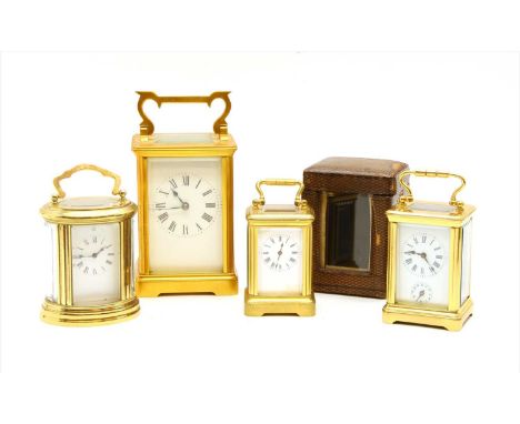 A collection of carriage clocks, to include a gilt metal example with shaped handle, miniature clock with leather travel case