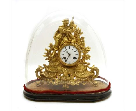 A 19th century gilt spelter mantel clock, the white enamel dial with Roman numerals and bell strike movement