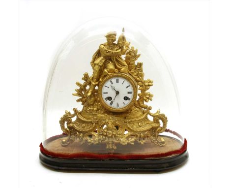 A 19th century gilt spelter mantel clock, the white enamel dial with Roman numerals and bell strike movement