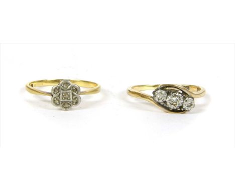 A gold diamond cluster ring, with an old eight cut diamond, grain set to the centre, to surround of rose cut diamonds, grain 