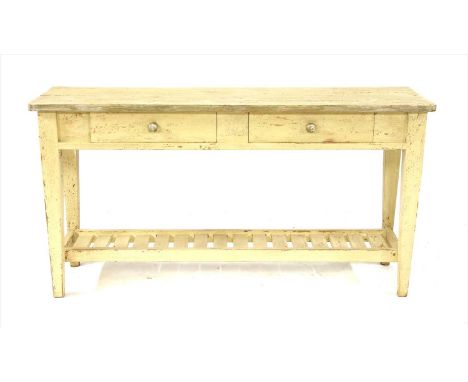 A painted pine hall table, the shaped rectangular top over two frieze drawers on square tapering legs joined by a slatted she