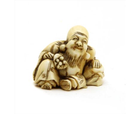 A Japanese ivory netsuke, Meiji period, in the form of Fukurokuju seated, bearing two character signature to base, 3cm high