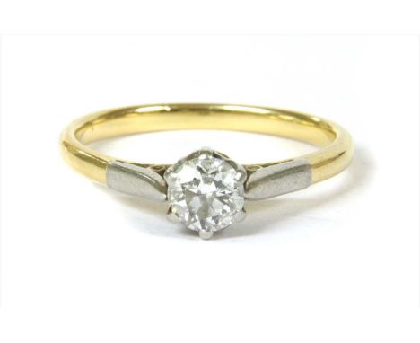 A gold single stone diamond ring, with a brilliant cut diamond, six claw set to pierced marquise motif gallery, with tapered 