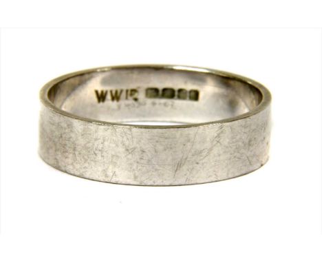 An 18ct white gold flat profile wedding ring, London 1972, 4.01g, finger size P½