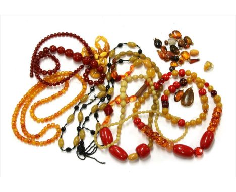 A single row graduated tumbled amber bead necklace, the largest bead approximately 22 x 9mm, 540mm long, 15.41g, together wit