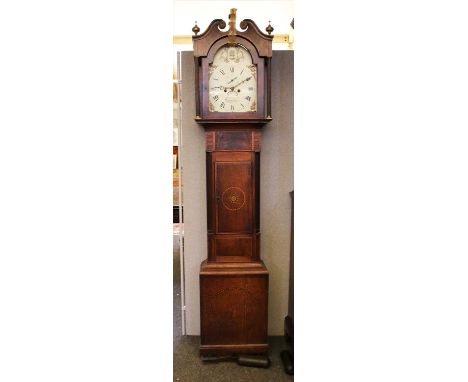 A George III inlaid oak and mahogany eight day longcase clock, by William Whitmore, having painted arched dial with bell stri