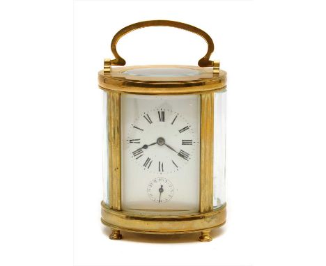 An early 20 th century gilt metal carriage clock, striking on a bell to the base, 13cm high