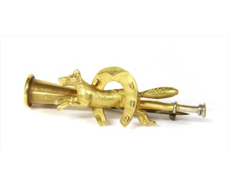 A gold hunting horn brooch, or stock pin, with applied fox and horseshoe motifs to the centre, marked 15ct, with metal pin, 4