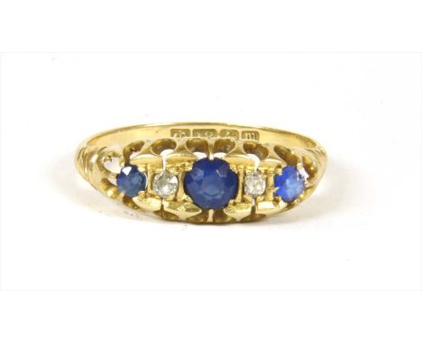 An 18ct gold sapphire and diamond ring, with a row of alternating round cut sapphires and Swiss cut diamonds, grain and claw 