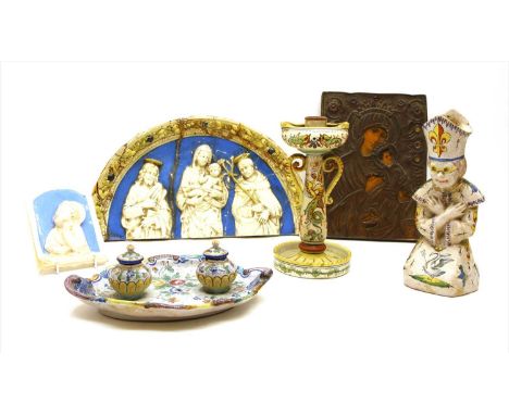 Two Della Robbia type plaques, together with three items of faience comprising ink well and two candlesticks and a Greek icon