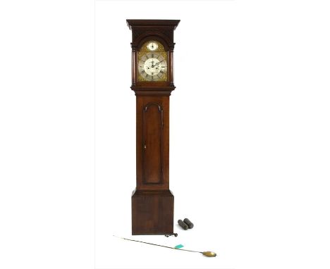 A George III mahogany cased eight day longcase clock, the silvered arched dial with brass spandrels, date aperture, seconds d