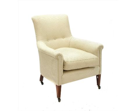 A cream upholstered low arm chair, on square tapering legs with brass and ceramic castors, 73cm wide, 63cm deep, 90cm high